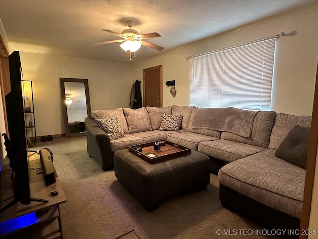 living room with ceiling fan and carpet flooring