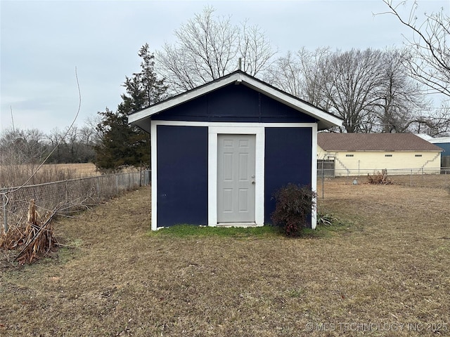 view of outdoor structure featuring a yard