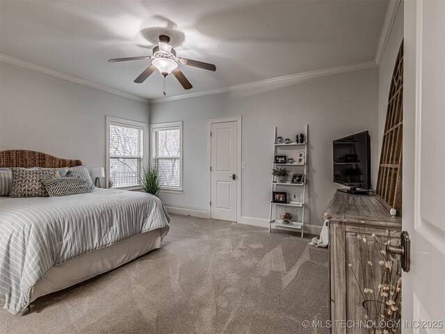 carpeted bedroom featuring crown molding and ceiling fan