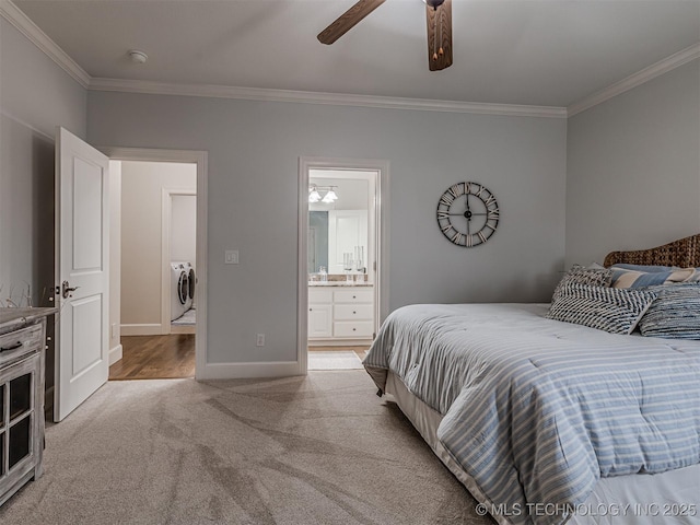 carpeted bedroom with ceiling fan, ornamental molding, connected bathroom, and washing machine and clothes dryer