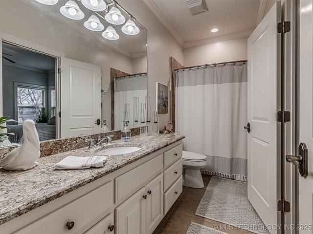 bathroom featuring crown molding, vanity, curtained shower, tile patterned floors, and toilet