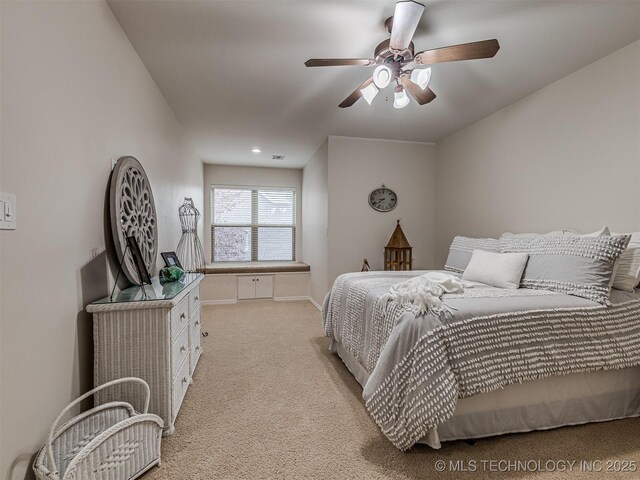 carpeted bedroom featuring ceiling fan