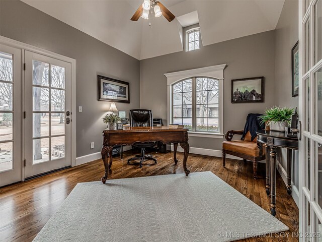 office area featuring dark hardwood / wood-style flooring, vaulted ceiling, and ceiling fan