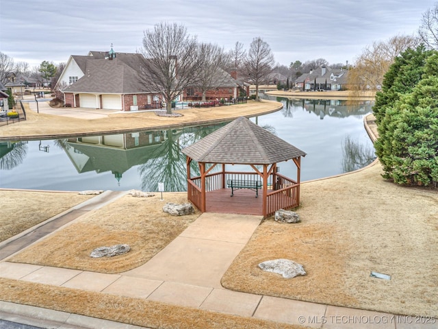 view of pool featuring a gazebo and a water view