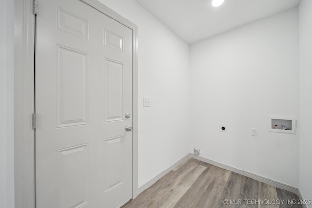 washroom with hookup for a washing machine, hookup for an electric dryer, and light wood-type flooring