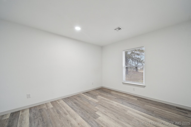 unfurnished room featuring light wood-type flooring