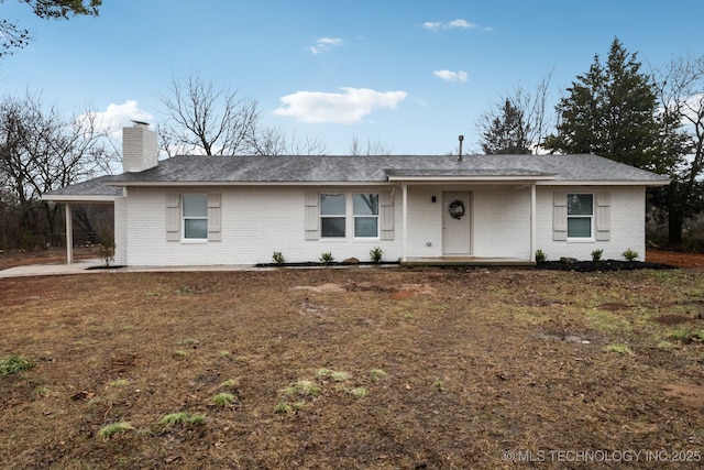 ranch-style home featuring a front yard