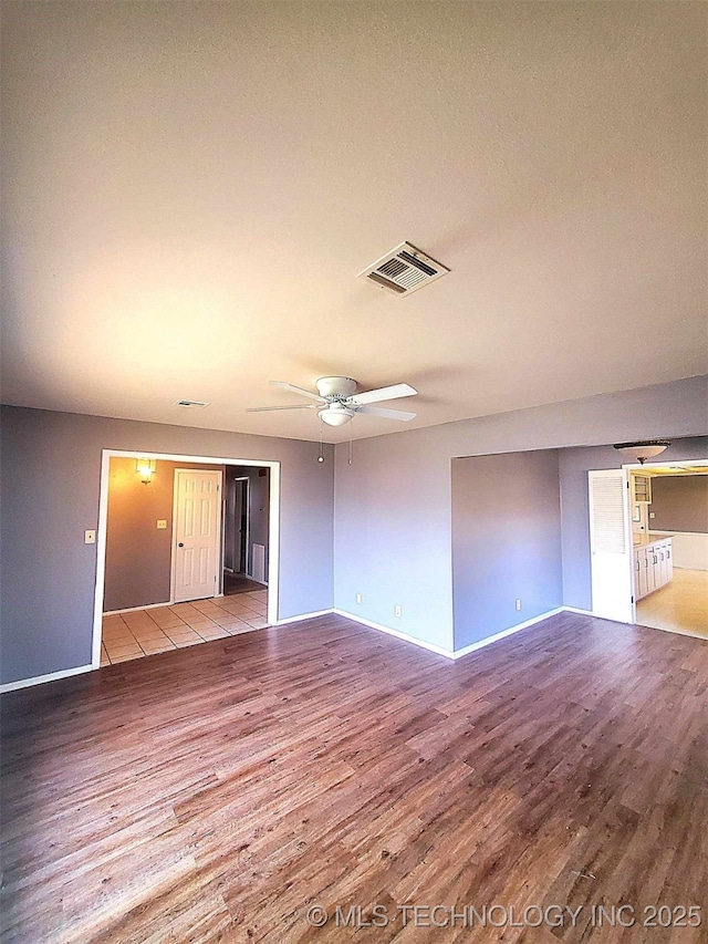 spare room with ceiling fan and light hardwood / wood-style flooring