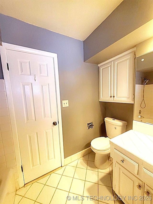 bathroom featuring tile patterned floors, vanity, and toilet