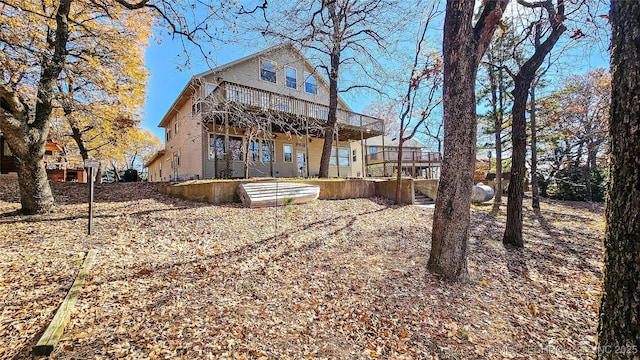 back of property with a wooden deck