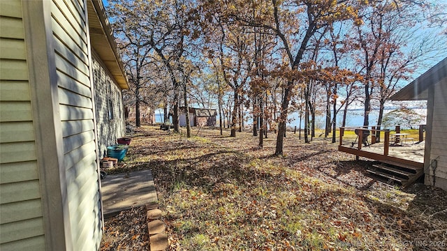 view of yard featuring a wooden deck