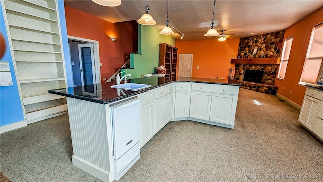 116568 S 4268th Rd, Checotah, OK 74426 - kitchen with a sink, ceiling fan, light colored carpet, and a fireplace