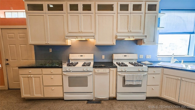 116568 S 4268th Rd, Checotah, OK 74426 - kitchen with white range with gas cooktop, under cabinet range hood, and dark countertops