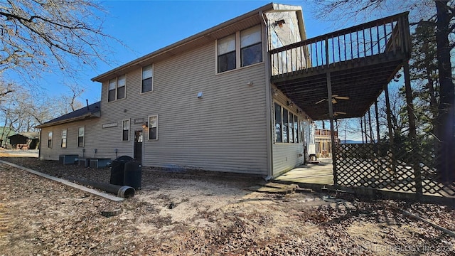 view of property exterior featuring central AC and ceiling fan