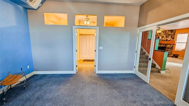 116568 S 4268th Rd, Checotah, OK 74426 - spare room with carpet, stairs, a ceiling fan, and baseboards