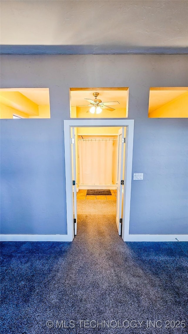 116568 S 4268th Rd, Checotah, OK 74426 - hallway with carpet floors and baseboards