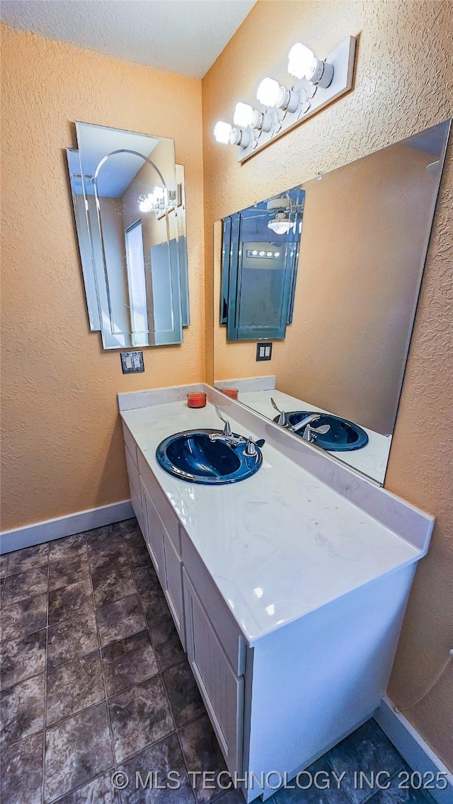 116568 S 4268th Rd, Checotah, OK 74426 - bathroom with baseboards, vanity, and a textured wall