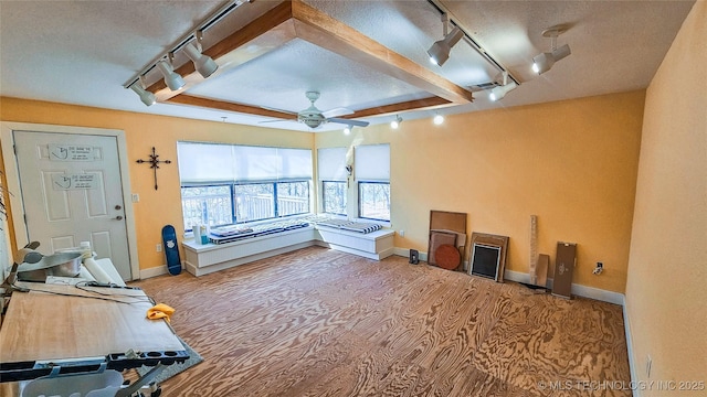 116568 S 4268th Rd, Checotah, OK 74426 - living room featuring track lighting, ceiling fan, a textured ceiling, and baseboards