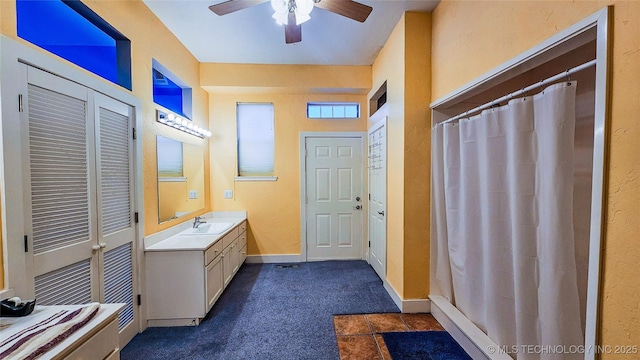 116568 S 4268th Rd, Checotah, OK 74426 - bathroom featuring vanity, a ceiling fan, curtained shower, and baseboards