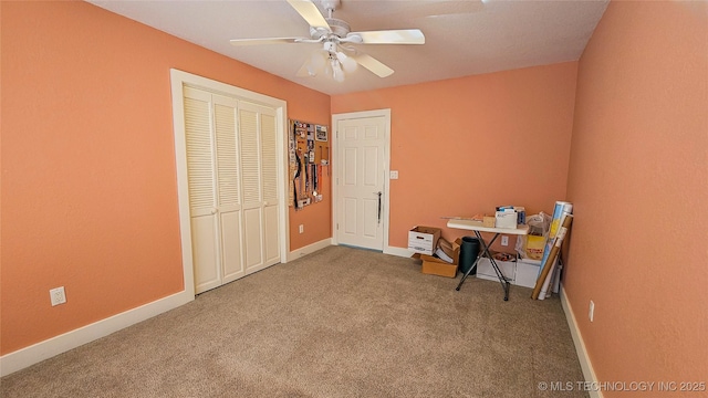 interior space with ceiling fan