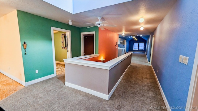 welcome area featuring a skylight, washer and dryer, and ceiling fan