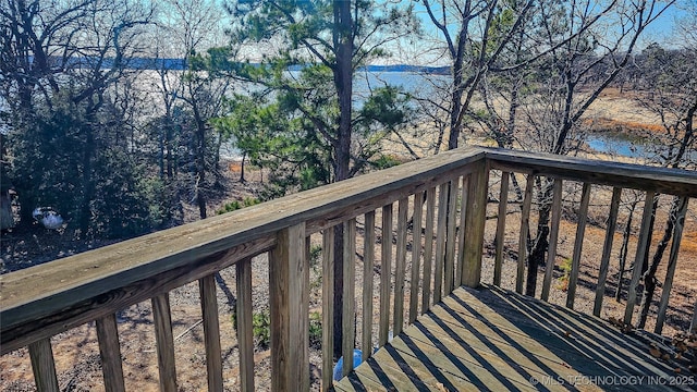 wooden deck featuring a water view