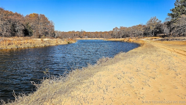 116568 S 4268th Rd, Checotah, OK 74426 - water view with a heavily wooded area