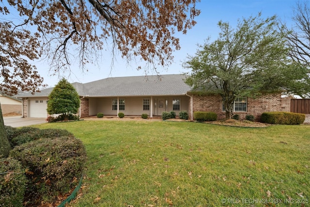 exterior space with a garage and a front lawn