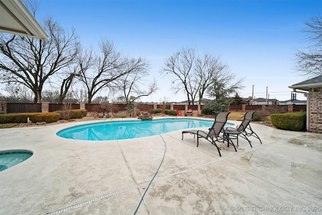 view of swimming pool with a patio