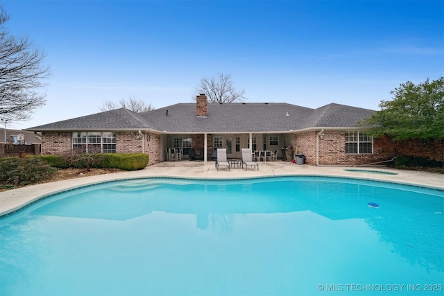 view of pool featuring a patio area