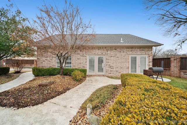 back of property featuring french doors and a patio