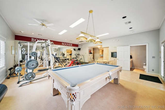 rec room featuring ceiling fan, billiards, ornamental molding, and light colored carpet