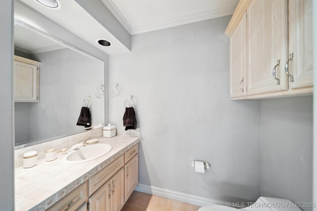 bathroom with vanity and ornamental molding