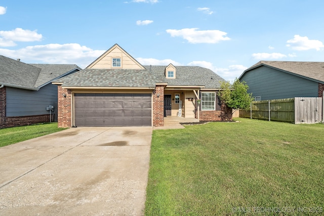 view of front of property with a garage and a front yard