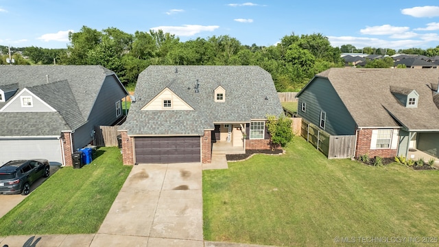 new england style home featuring a garage and a front yard