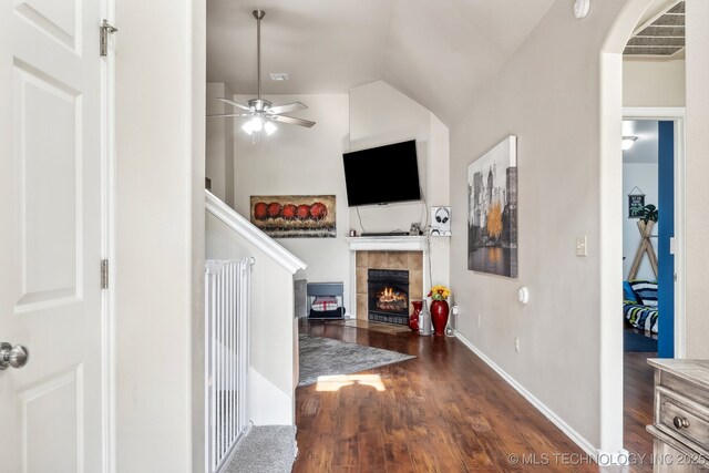 interior space with vaulted ceiling and dark hardwood / wood-style floors