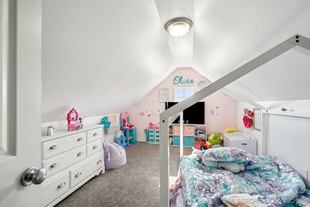 bedroom with lofted ceiling and carpet floors