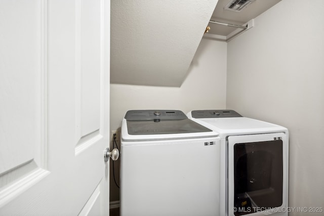 laundry room featuring washer and clothes dryer