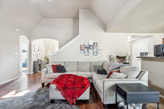 living room with lofted ceiling and dark hardwood / wood-style flooring