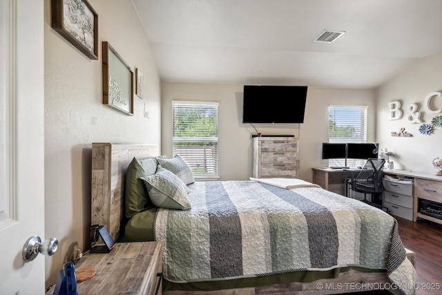 bedroom with dark hardwood / wood-style floors