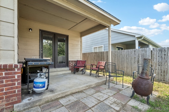 view of patio featuring a grill