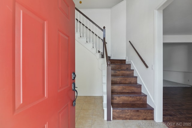 entrance foyer featuring light tile patterned flooring