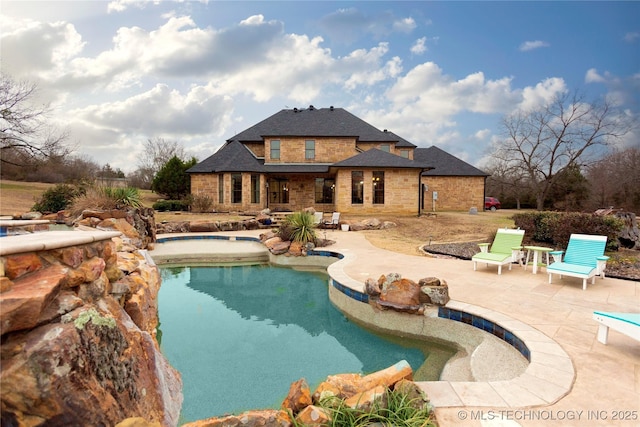 view of swimming pool featuring a patio area