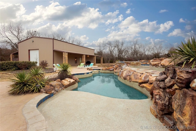 view of pool featuring a patio