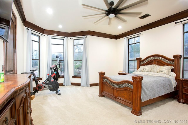 bedroom featuring crown molding and light colored carpet