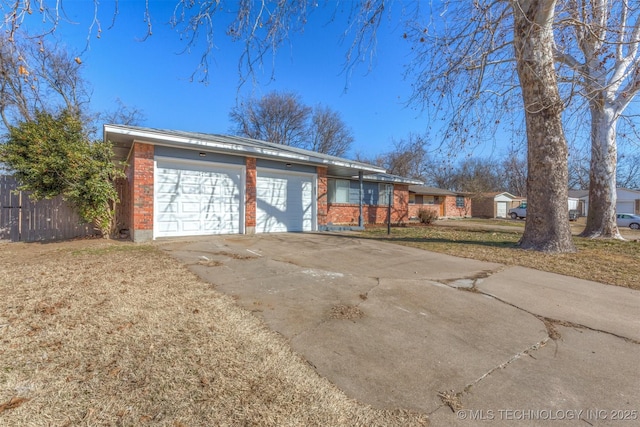 single story home featuring a garage and a front yard