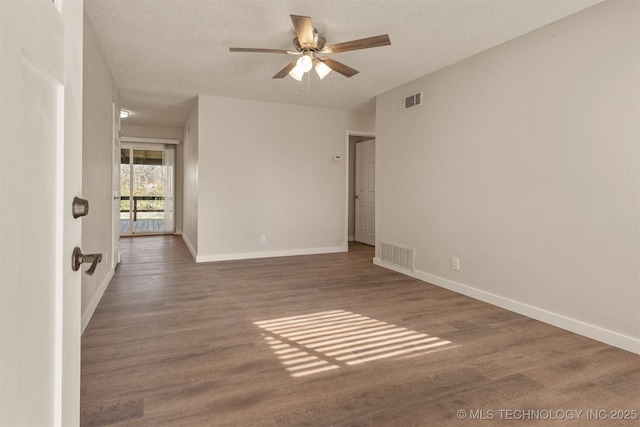 unfurnished room featuring ceiling fan, a textured ceiling, and dark hardwood / wood-style flooring