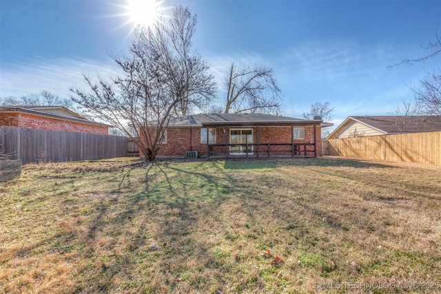 rear view of house with a lawn