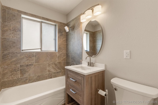 full bathroom with tiled shower / bath combo, vanity, and toilet