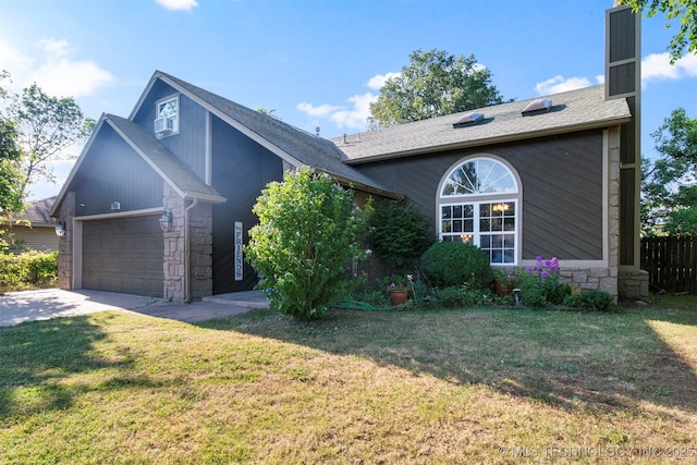 view of front facade with a garage and a front lawn